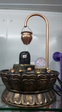Magic Shivling FountainWater Fountain for Home Table Top DecorationMaterial - FiberHeight - 1.5 feetWeight - 2.5 KgPrice -  ₹2,699.00M.R.P.: ₹2,999.00 Booking compulsoryNo Discount - Height 1.5 Feet