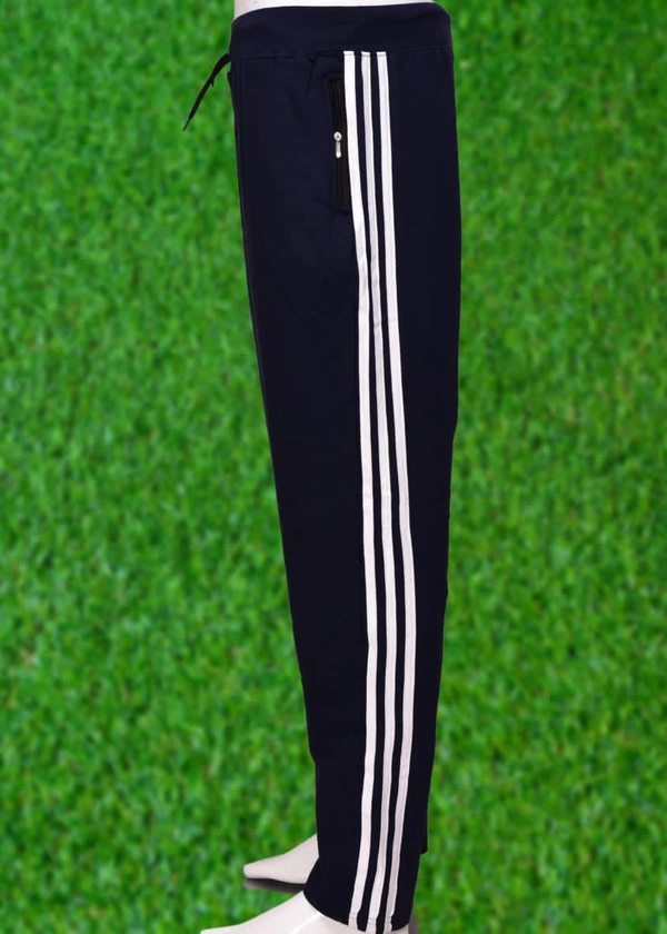 *Human Sparsh Track Pants - Black*Whether you want to run, relax or sleep, these track pants would be a great choice for you. Black Colour goes well with almost all the t-shirts.Design: Solid Colour with Stripes on the sidesPockets: Double Side Pockets with Zip and a Back PocketWaist: It has the elasticated waistband with drawstringsFit: RegularMaterial: 280 gsm Cotton fabricWash: - L