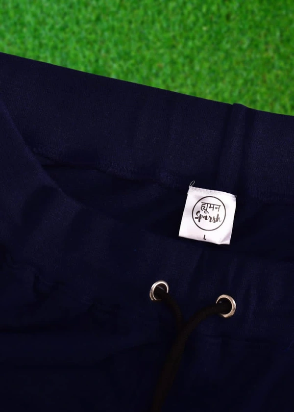 *Human Sparsh Track Pants - Navy Blue*Have the feel of Authority and Calmness at the same time when wearing the Navy Blue Colour.Whether you want to run, relax or sleep, these track pants would be a great choice for you.Design: Solid Colour with Stripes on the sidesPockets: Double Side Pockets with Zip and a Back PocketWaist: It has the elasticated waistband with drawstringsFit: Re - L