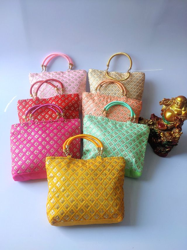 Multi pocket canvas purse with mustard ikat fabric