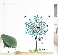 Blue Tree With Birds Cage And Nest