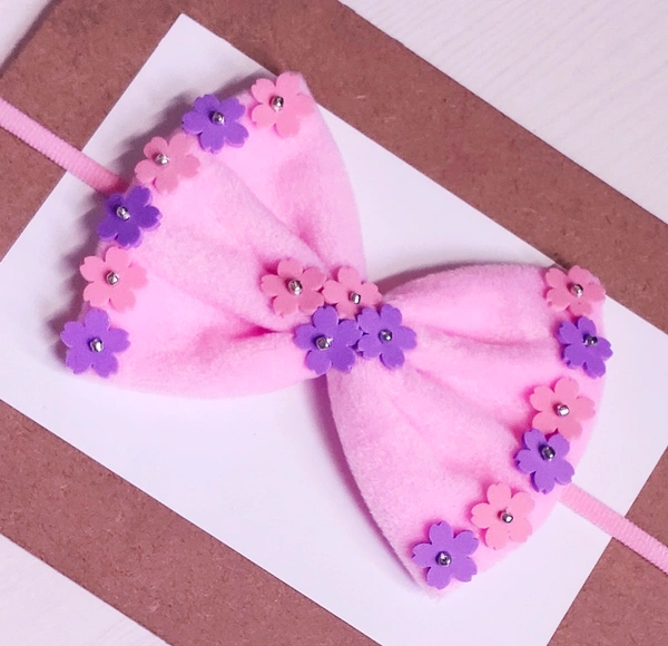 Pink Colour Soft Bow Embellished With tiny Flowers.  - Free Size Stretchable Headband