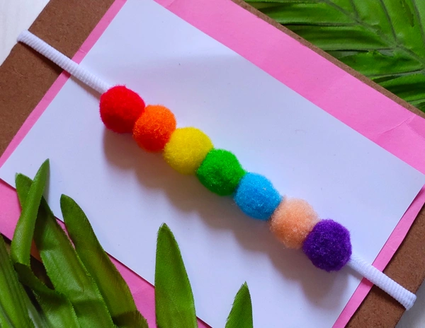  Pom Pom Headband made With Small Pompoms.  - Stretchable Headband.