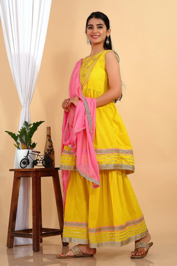 Premium heavy cotton lurex designer tire pattern gown with side slit detailed with heavy gota work all over. - L