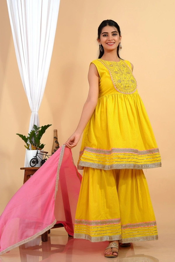 Premium heavy cotton lurex designer tire pattern gown with side slit detailed with heavy gota work all over. - L