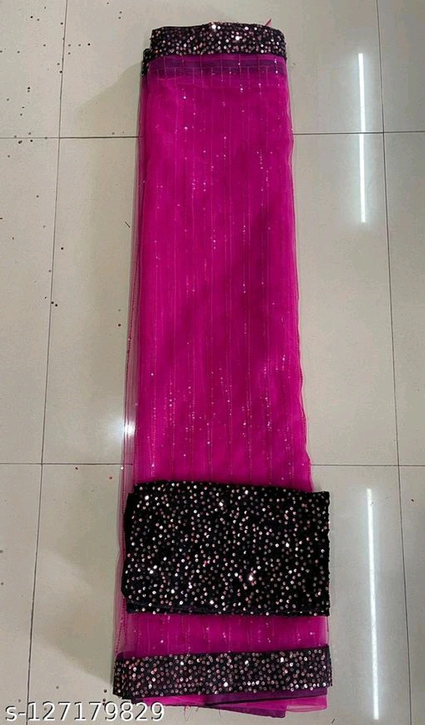 Ready To Wear Net Light Pink Sequinned Saree With BlouseName: Ready To Wear Net Light Pink Sequinned Saree With BlouseSaree Fabric: NetBlouse: Separate Blouse PieceBlouse Fabric: VelvetPattern: EmbellishedBlouse Pattern: Same as BorderNet Quantity (N): SingleSAREE FABRIC : Heavy Pure butter fly net , WORK : Beautiful sequence work with 5 mm hanging sequnce tone to tone lace broder  - Tickle Me Pink