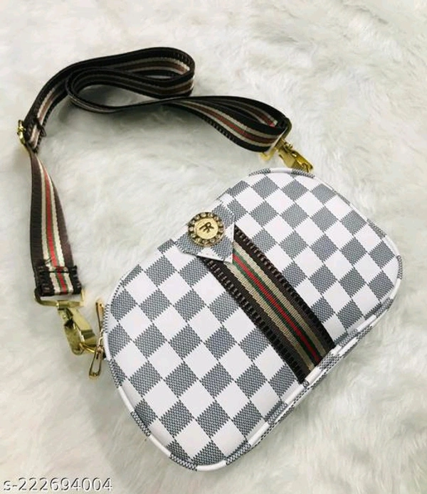 Voguish Alluring Women SlingbagsName: Voguish Alluring Women SlingbagsMaterial: PUNo. of Compartments: 2Pattern: PrintedNet Quantity (N): 1Sizes:Free Size (Length Size: 9 in, Width Size: 3 in, Height Size: 6 in) classy look sling bag with 2 main compartmentName: classy look sling bag with 2 main compartmentMaterial: PUPattern: CheckedSizes:Free Size (Length Size: 10 in, Width Size: - White, Free Size