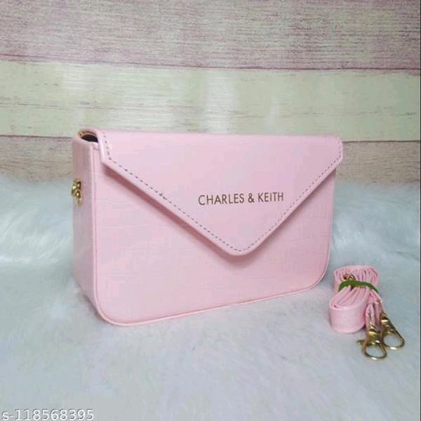 Small Sling Bag.Name: Small Sling Bag.Material: PUNo. of Compartments: 2Pattern: Self DesignNet Quantity (N): 1Sizes:Free Size (Length Size: 7 in, Width Size: 2 in, Height Size: 5 in) Box Sling Bag with long belt handle adjustable size for Stylish Girls.Country of Origin: India - Pink, Free Size
