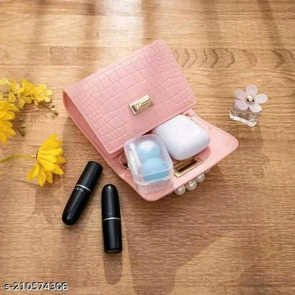 Mini jelly purse and handbags,waterproof and washable sling bagName: Mini jelly purse and handbags,waterproof and washable sling bagMaterial: PUNo. of Compartments: 1Pattern: SolidNet Quantity (N): 1Sizes:Free Size (Length Size: 5 in, Width Size: 2 in, Height Size: 4 in) Level up your accessory game with the Mini Jelly Sling Bag. Available in a trendy pearl handle for small girls a - Pink