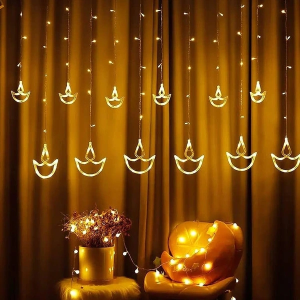 6+6 DIYA LIGHT WW, Diwali Diya String Lights – 12 Hanging Diyas, 8 Flashing Modes, USB & Battery Powered Warm White Decorative Lights for Wall, Window, Fence & Party Decor(42)