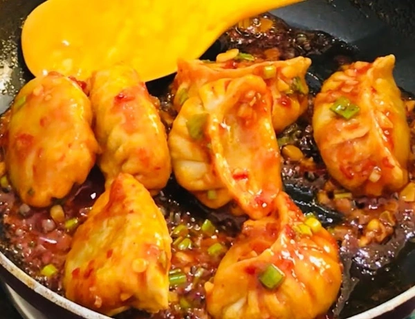Veg Momos Tossed in Schezwan Sauce