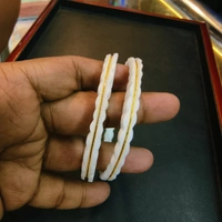 TRJ AURUM SAKHA HALLMARK 916 22KT GOLD SAKHA BADHANO APPROX. WGT: 0.250 GM WITH PURITY SMART CARD - 24