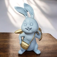 Sold By ZAIN R CREATION Rabbit With Carrot Showpiece for Home Decor - H.7'' L.4'' B.3'', Polyresin
