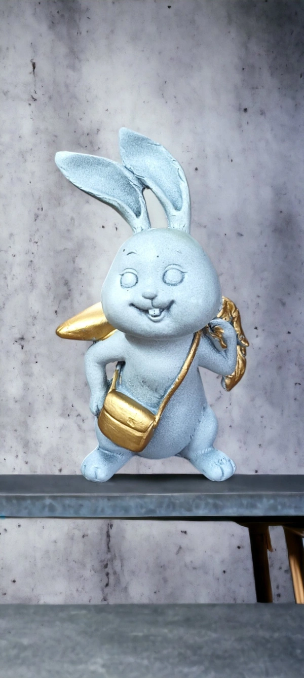 Sold By ZAIN R CREATION Rabbit With Carrot Showpiece for Home Decor - H.7'' L.4'' B.3'', Polyresin