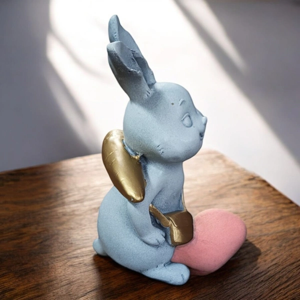 Sold By ZAIN R CREATION Rabbit With Carrot Showpiece for Home Decor - H.7'' L.4'' B.3'', Polyresin