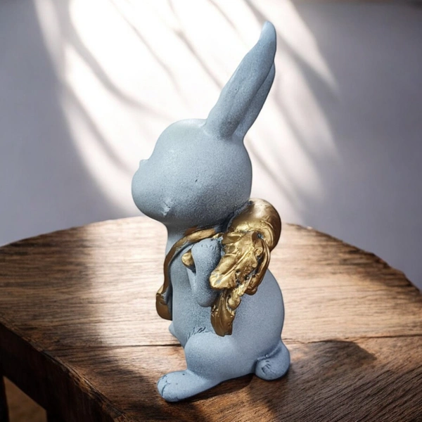 Sold By ZAIN R CREATION Rabbit With Carrot Showpiece for Home Decor - H.7'' L.4'' B.3'', Polyresin