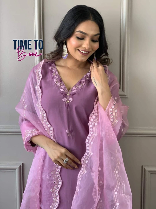 Featuring beautiful Heavy Suit Set which is beautifully decorated with intricate hand embroidery, Zari weaving . It is paired with matching pants and embroidery Dupatta - M-38