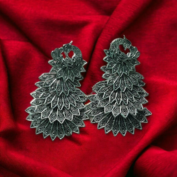 5 Layer Morr Earring For Girls and Women. (Green Color) Earrings & StudsBase Metal : AlloyPlating : Brass PlatedSizing : AdjustableStone Type : Artificial StonesType : JhumkhasNet Quantity (N) : 15 Layer Morr Earring For Girls and Women.Country of Origin : India