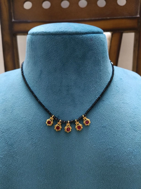 BLACK DIAMONDS WITH SMALL LOCKET