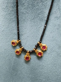 BLACK DIAMONDS WITH SMALL LOCKET