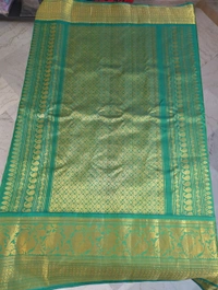 Pure Handloom Gadwal Pattu With Kuttu Boarders  - Green