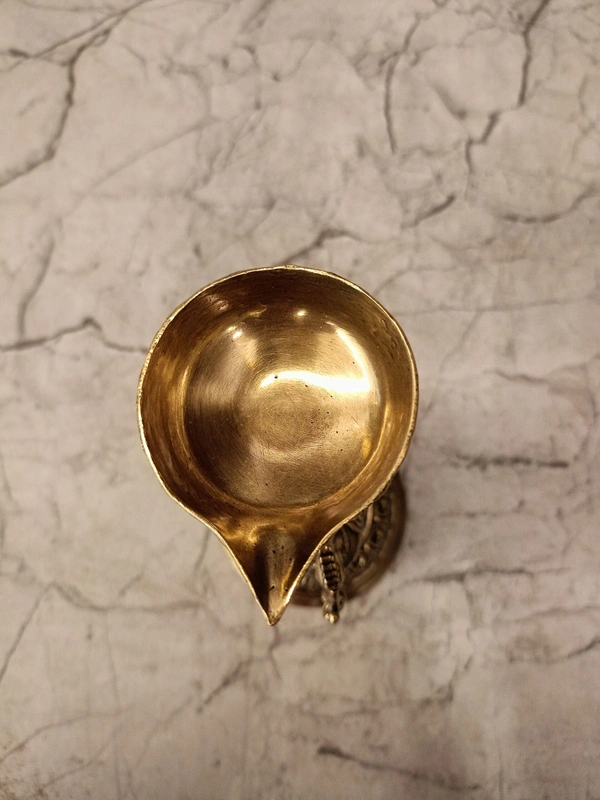Brass Fine Art Peacock Holding Diya