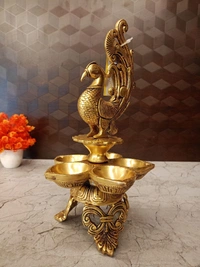 DecorsOne Brass Five face Peacock Diya With Decorative Base 12″