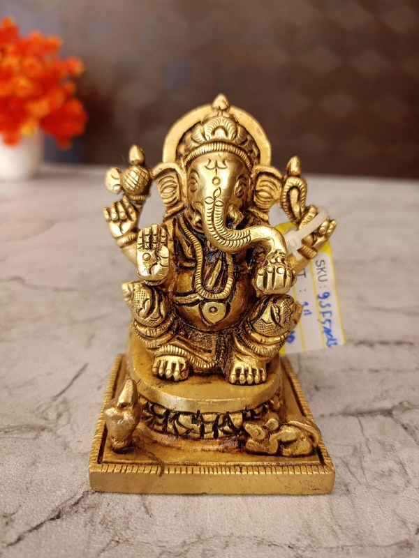 Brass Ganesha statue Sitting On Square base With Kalasam / Anchor Your Home in Divine Tranquility with Our Seated Brass Ganesha Idol