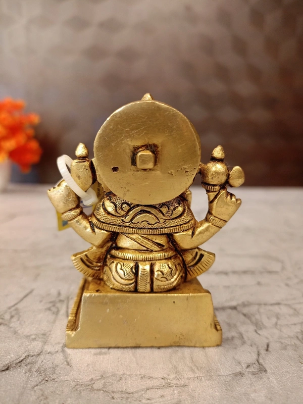 Brass Ganesha statue Sitting On Square base With Kalasam / Anchor Your Home in Divine Tranquility with Our Seated Brass Ganesha Idol