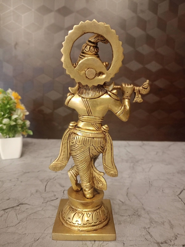 Brass Krishna with peacock feather on head 