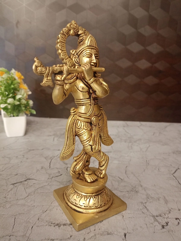 Brass Krishna with peacock feather on head 