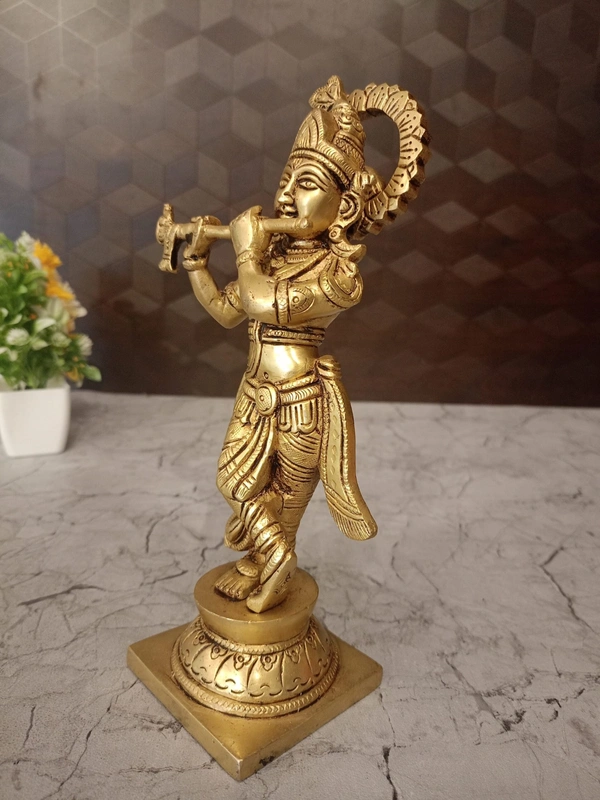 Brass Krishna with peacock feather on head 