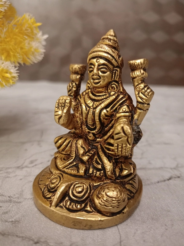 Buy Brass Lakshmi Idol Sitting On Round Base With Flowers