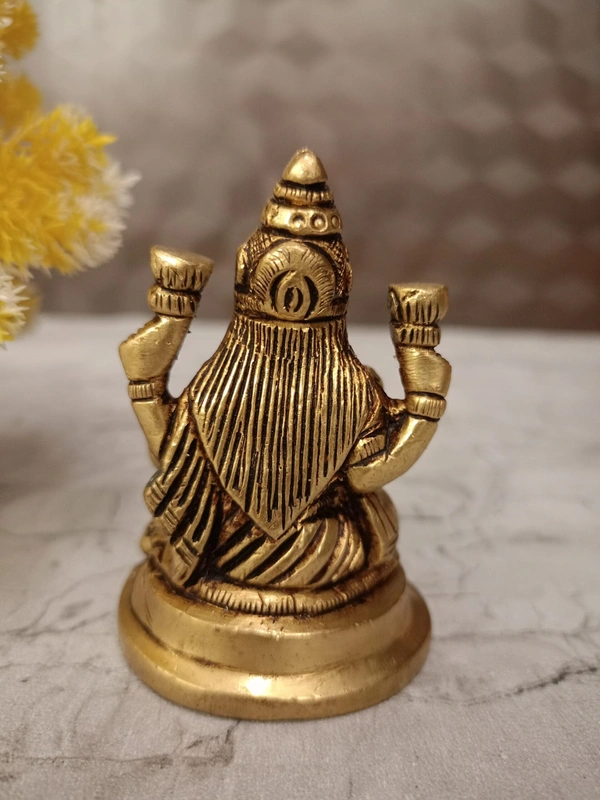Buy Brass Lakshmi Idol Sitting On Round Base With Flowers