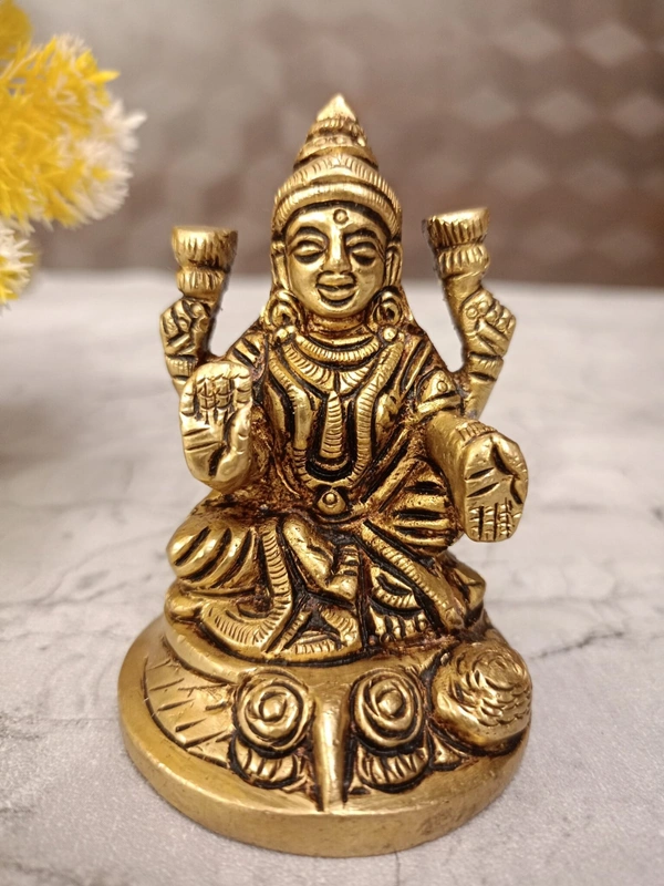 Buy Brass Lakshmi Idol Sitting On Round Base With Flowers