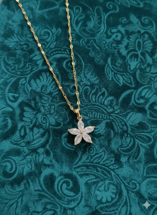Pendant Style: A delicate, nature-inspired floral motif featuring a five-petal star/flower design.  