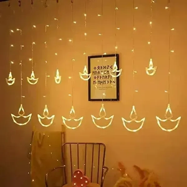 TLISMI Decorative LED Diya Curtain Light- 3m| 6+6 Diya & 138 LED Window Curtain Lights with 8 Flashing Modes for Diwali, Wedding, Party, Festivals, Home Decoration Light (Warm White)