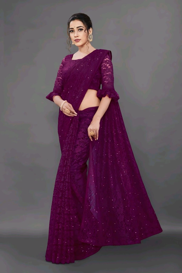 Brasso Net Purple Beads & StonesSaree With Blouse. Drape it with a contrast blouse and complement with fine jewelry to create a graceful, timeless look.  - Free Size