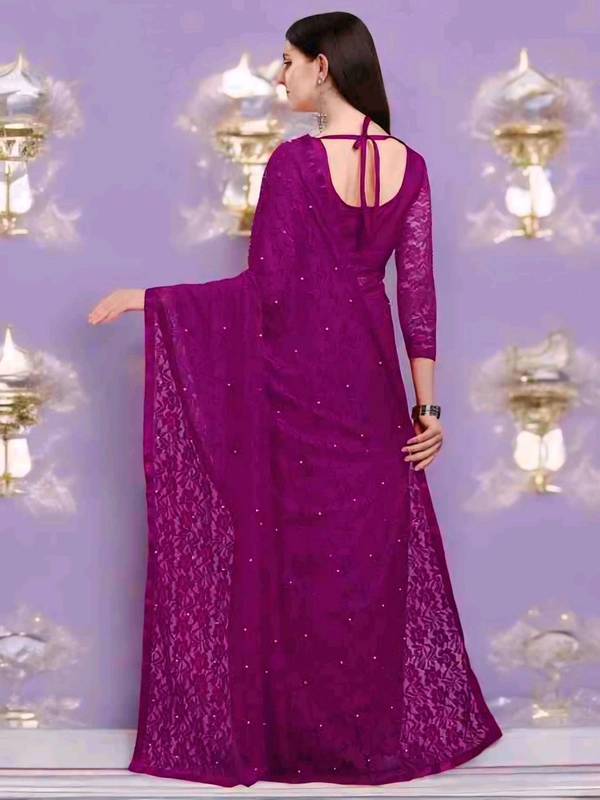 Brasso Net Purple Beads & StonesSaree With Blouse. Drape it with a contrast blouse and complement with fine jewelry to create a graceful, timeless look.  - Free Size