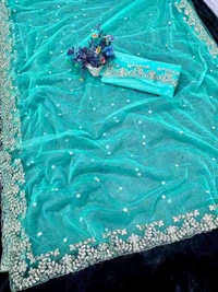 hazaar butti Net Aqua Blue Embroidered Saree. Paired with a matching blouse, the saree offers a contemporary yet traditional look. Its lightweight nature ensures comfort while draping beautifully, allowing you to make a graceful statement wherever you go. - Free Size