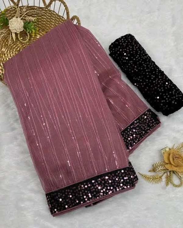 UNIQUE DESIGN SEQUINS WORK SAREE WITH BLOUSE PIECE. This masterpiece features intricate sequin work crafted in a rhythmic pattern that reflects timeless sophistication. Designed to make every occasion extraordinary, this saree combines luxury with comfort, perfect for weddings, parties, or festive gatherings.  - Free Size