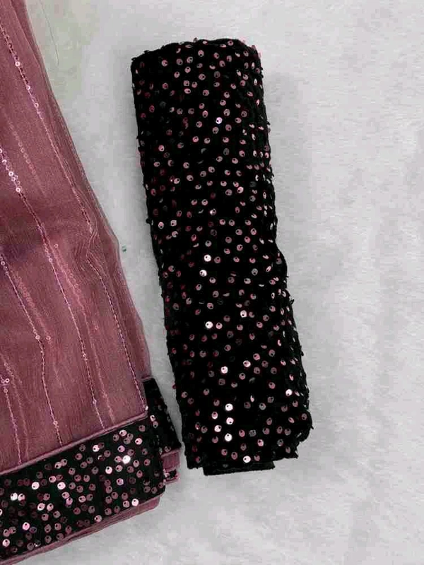 UNIQUE DESIGN SEQUINS WORK SAREE WITH BLOUSE PIECE. This masterpiece features intricate sequin work crafted in a rhythmic pattern that reflects timeless sophistication. Designed to make every occasion extraordinary, this saree combines luxury with comfort, perfect for weddings, parties, or festive gatherings.  - Free Size