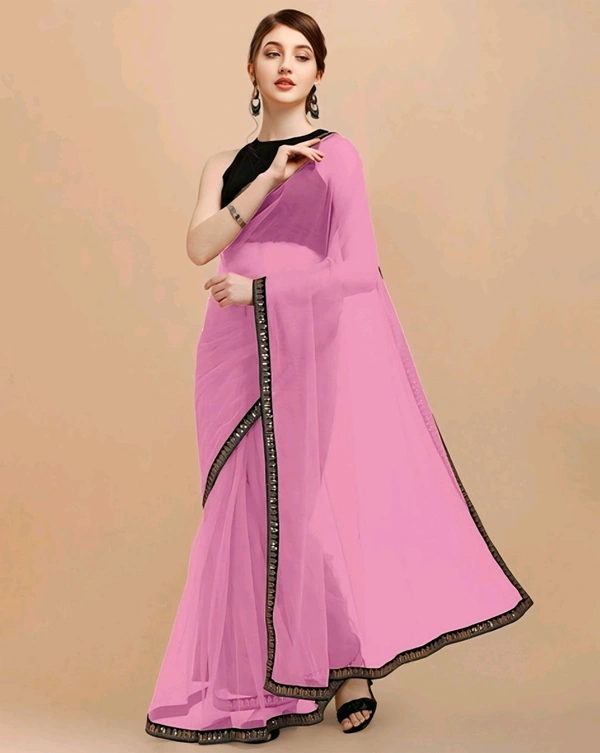 Net  Pink Lace border Saree With Blouse. Elevate your elegance with our exquisite Net Lace Saree, a perfect blend of sophistication and glamour. Crafted from high-quality net fabric, this saree features intricate lace detailing that exudes timeless charm. - Free Size