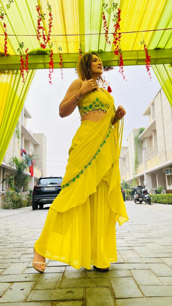 GET READY FOR UPCOMING FESTIVITIES AND WEDDING CELEBRATIONS WITH THIS GARARA DRAPE READY TO WEAR SAREE WITH TWO BLOUSE OPTIONS EMBELLISHED WITH REAL MIRROR HAND WORK AND ZARI EMBROIDERY, KAUDI HANGINGS. - Xs (34)
