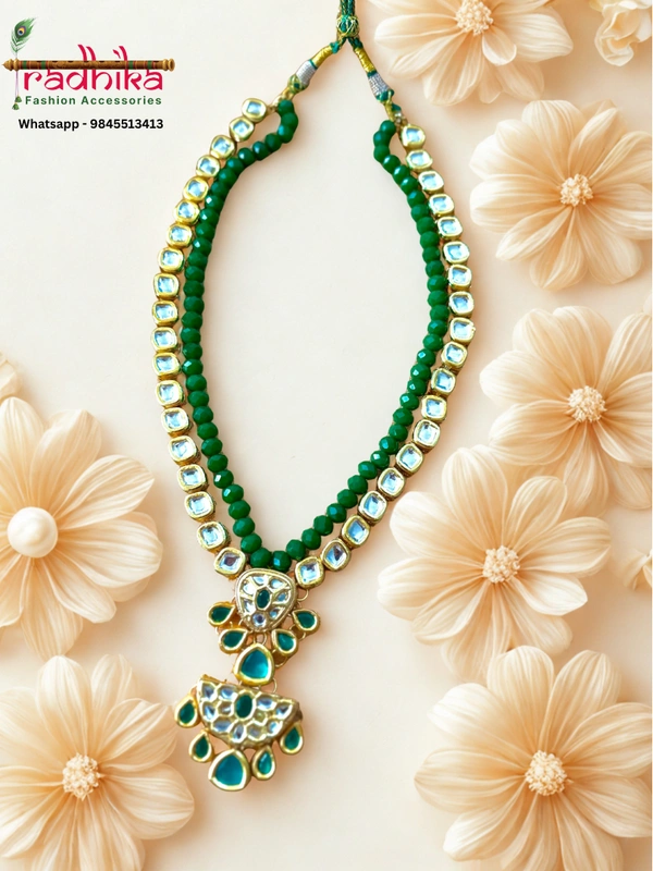 2-layer necklace crafted from shimmering Kundan stones and sparkling crystal beads, with two matching pendants, paired with coordinated earrings.