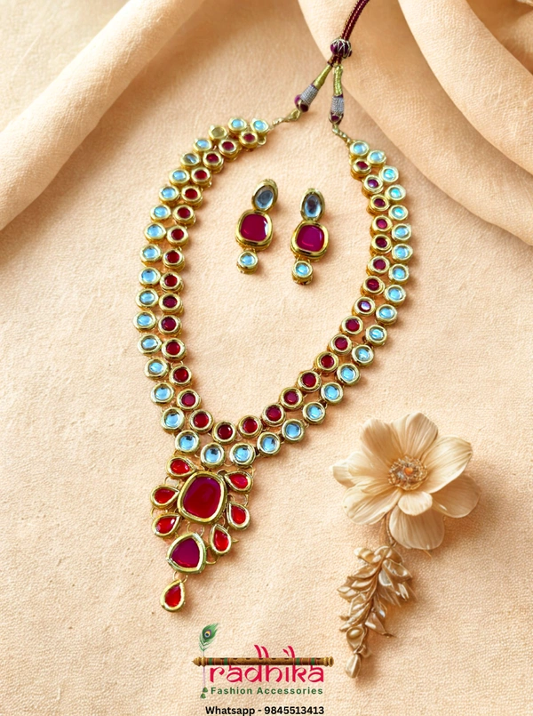 2-layered Kundan necklace with a stunning combination of white and red Kundan stones in a richly traditional design.