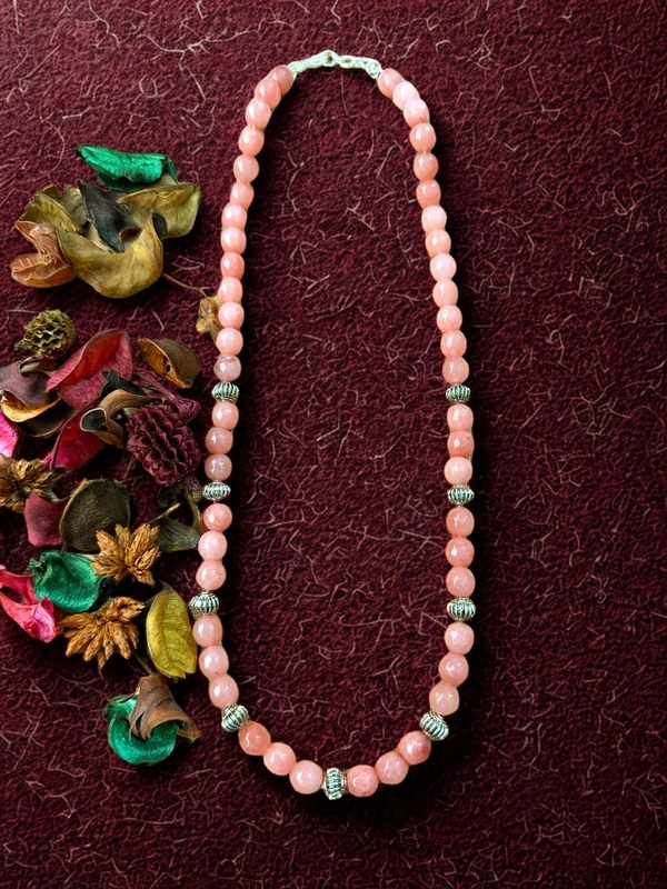 Colored beaded necklace with oxidised beads placed at regular intervals