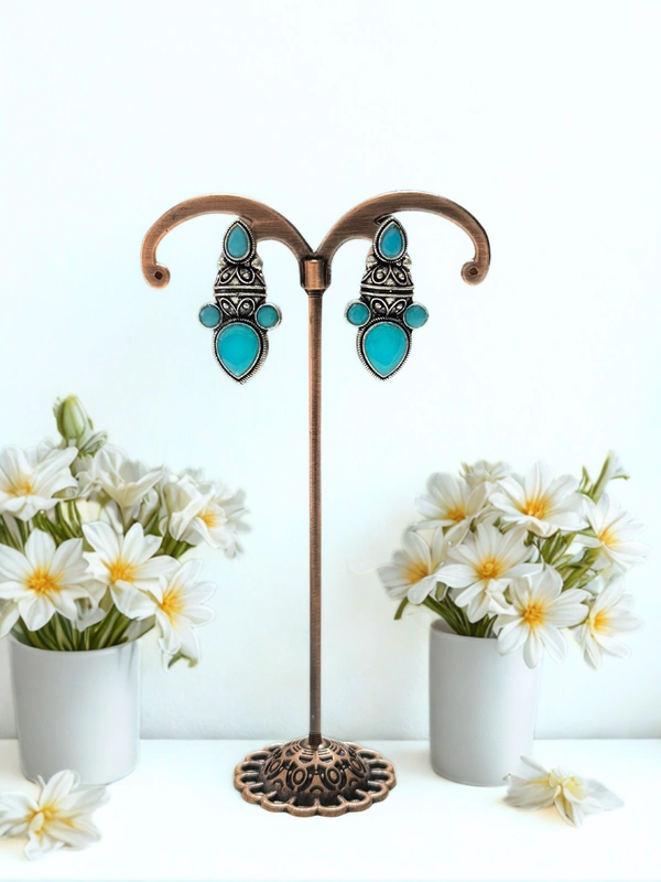 Compact Dangler With Stricking Colored Stones