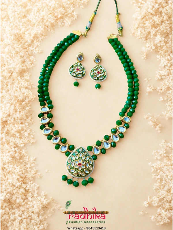 Elegant crystal beaded 2 layer Kundan necklace set, a beautifully detailed pendant, and perfectly matching earrings.