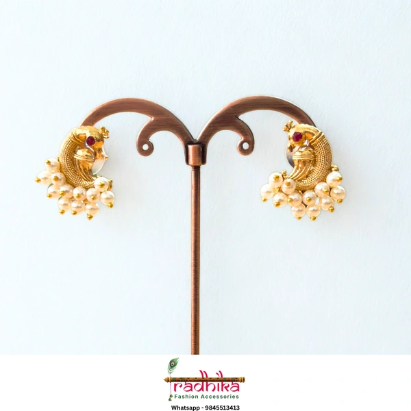Elegant gold peacock shape studs with pearls